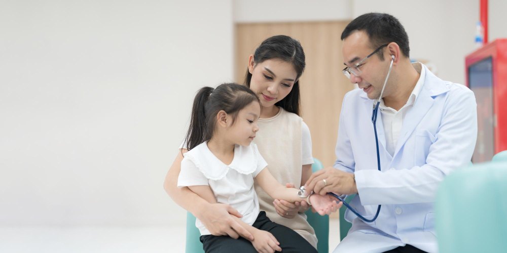 A doctor is checking a child